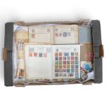 A collection of UK, Commonwealth and World stamps, loose and in albums. (1 Tray)
