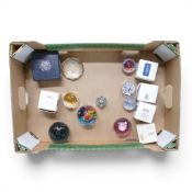 A collection of mainly Caithness glass decorative paperweights featuring intricate millefiori