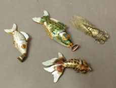 Three articulated and enamelled fish pendants, length of longest 10cm, together with a French Lucite