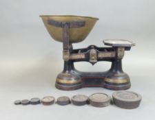 Baxendale, early 20th century cast iron weighing scales with weights.
