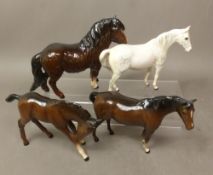 Group of four Beswick/Royal Doulton horses, to include a grey small stallion, and brown Shetland,