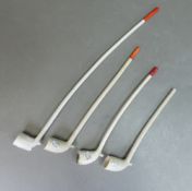 Vintage clay tobacco pipes of various sizes. (Longest: 33cm) (4)