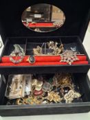 Vintage jewellery box containing vintage and modern costume jewellery, mostly brooches, with