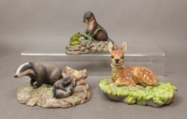 A trio of Border Fine Arts resin sculptures, Otter, Fawn and Badgers, height of tallest 8cm (3).