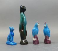 A Pair Of Chinese Porcelain Parrots In Vibrant Turquoise Glaze On The Birds And A Deep Purple On The