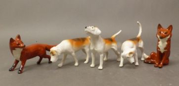 3 Beswick Matt Foxhounds together with seated and standing fox (5)