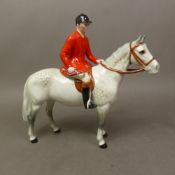 Beswick model of a Huntsman mounted on grey horse.