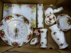 Royal Albert Old Country Roses pattern items to include 6 placemats, 3 vases, a wall clock, floral