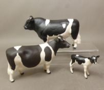 Beswick Fresian cattle family, including Champion Claybury Leegwater cow, Champion Coddington Hilt