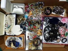 A collection of costume jewellery to include necklaces, brooches, bangles, together with a boxed