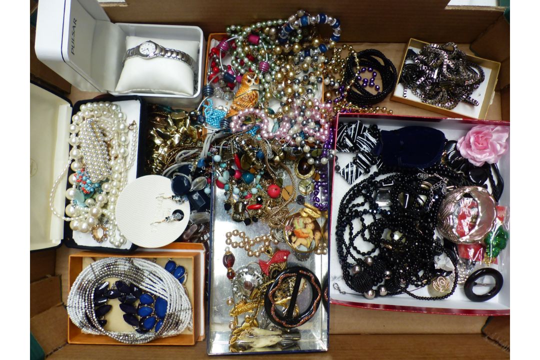 A collection of costume jewellery to include necklaces, brooches, bangles, together with a boxed