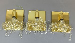 Mid-century brass and crystal wall lights. (3)
