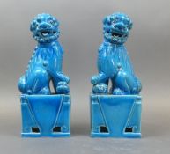 A Pair Of Chinese Porcelain 'Foo Dogs' Also Known As Guardian Lions In A Distinct Turquoise Blue.