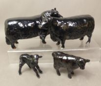 Beswick Aberdeen Angus cattle family, including Bull, cow and two calves in a gloss finish (3)