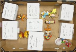 A collection of Disney character's Christmas Magic ornaments to include Minnie Mouse (needs