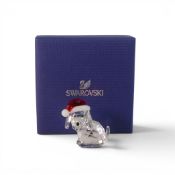 Swarovski Dog in a Santa Hat (5060449) retired 2017 designed by Verena Castelein presented in