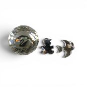 Swarovski SCS round faceted paper weight together with two mirrored brooch pins depicting a