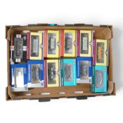 A Collection of 00 Gauge Freight Wagons, Vans and Tankers from various Manufacturers including:-