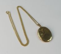 9ct gold large oval pendant and chain, 9.8g.