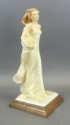 A.D.L Vittorio Tessaro lady figurine of a lady in a flowing dress holding a bouquet of flowers,