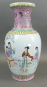 Tall Oriental Design Vase Featuring Geisha Girls At Work With Floral Patterns On Pink Ground Detail.