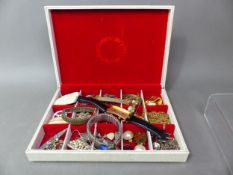 A collection of costume jewellery in a leather box including silver, rings, watches, pendants etc