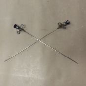 Two silver topped hatpins, maker Charles Horner, Chester, of swirled design with thistle