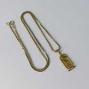 Yellow metal Egyptian Cartouche pendant and chain, electronically tested to be at least 18ct gold,