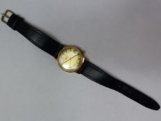 A Bulova Accutron 9ct gold circular cased gentleman's wristwatch, the signed brushed gilt dial