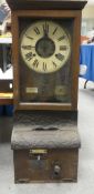 A Factory 'clocking on' time record machine by The British Time Recording company, app height 87cm