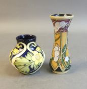 Moorcroft vase in the Buttercup Meadow pattern, by Paul Hilditch, together with vase in Fleurs