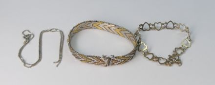 925 silver items, a bracelet with gold plated design highlights, a bracelet made up of linked heart
