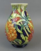 A Moorcroft limited edition vase in the Passion fruit design by Kerry Goodwin , made in an edition