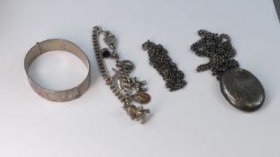 A collection of Silver jewellery including bracelet, charm bracelet and oval locket & chain, 147.