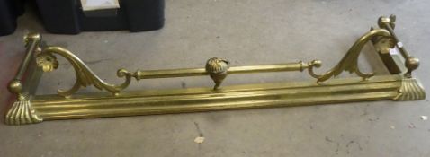Late 19th/early 20th century brass fireplace fender, with decorative ornate scroll design, moulded