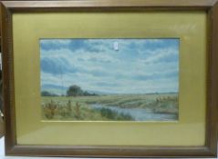 Framed watercolour depicting rural landscape, featuring a river running through pastoral meadows
