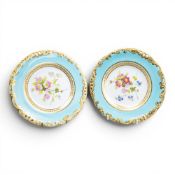 Two Copeland plates, both ornately decorated with flowers in a central frieze and ornate gilding,