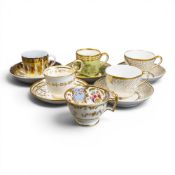 A collection of 18th and 19th century porcelain tea cups, coffee cans and saucers in various