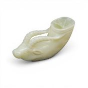 Jade modelled as a stirrup cup with head of a horned animal. (L: 10cm)