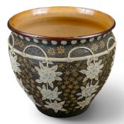 A Doulton Slaters patent Jardiniere, c1890, decorated with white embossed flowers against a green