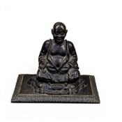 Early Bronze figure of Buddha seated on a cushion. (H: 10.5cm x W: 13cm x D: 8.5cm)