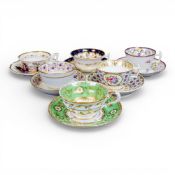A collection of 19th century porcelain tea cups in various patterns from different manufacturers