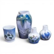 Royal Copenhagen porcelain vases of various sizes, hand-painted with wildflower patterns,