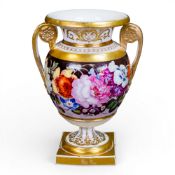 19th century porcelain twin-handled vase, featuring floral bouquet painted on a dark burgundy/