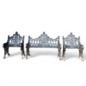 19th century Victorian-style iron garden benches with Gothic-inspired ornamentation, two single-