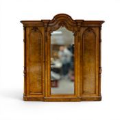 A Victorian burr walnut three door wardrobe with centre mirrored door & fitted interior, H229cm x