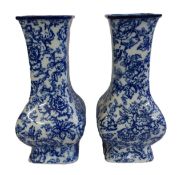 Pair of Keelings & Co. Losol Ware Cavendish blue and white decorated shaped vases, h.33cm. (2)