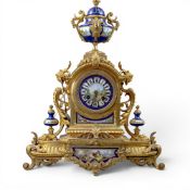 19th century French gilt metal mantle clock with hand painted porcelain fitments, the enamelled dial