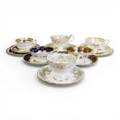 A collection of 19th century porcelain tea cups in various patterns from different manufacturers