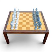 A Lladro Chess set, designed by Julio Fernandez, pieces in opposing colours, approx. height of